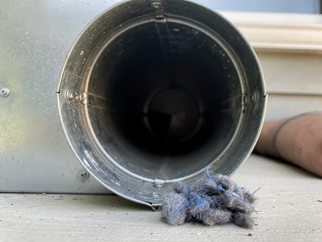 Redondo Beach Dryer Vent Cleaning technician using specialized equipment to clear severe dryer vent blockage in Redondo Beach